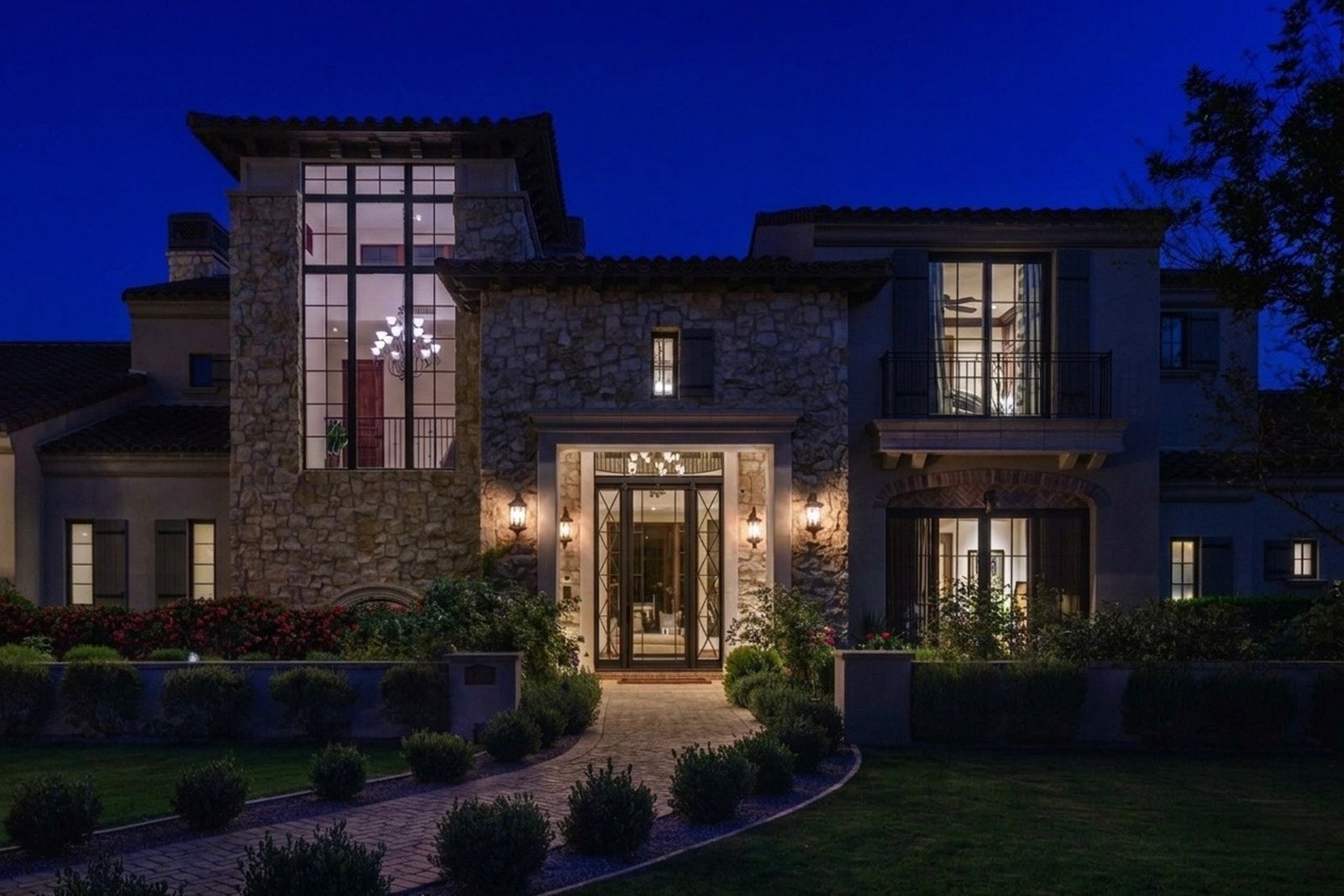 The same Phoenix home at dusk before permanent trim lighting, with the lights off